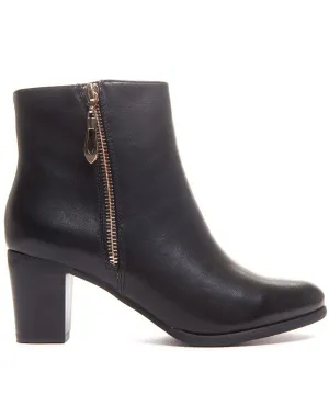 Bottine noire à petit talon et fermeture décorative
